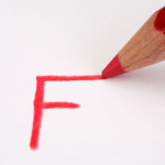 Red pencil marking an F on paper close up. Image shot 2009. Exact date unknown.